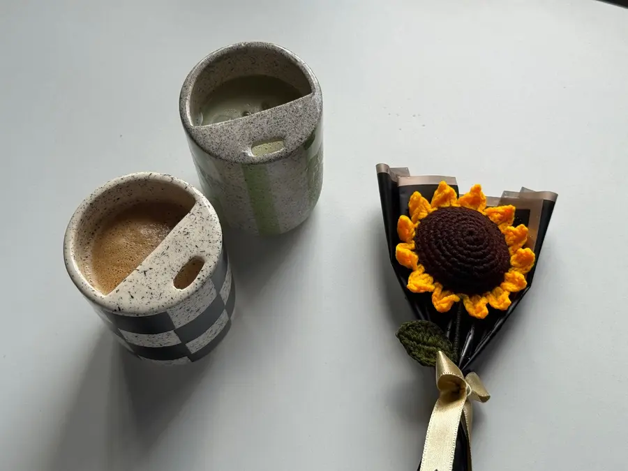 Coffee and matcha flat lay with a crochet sunflower